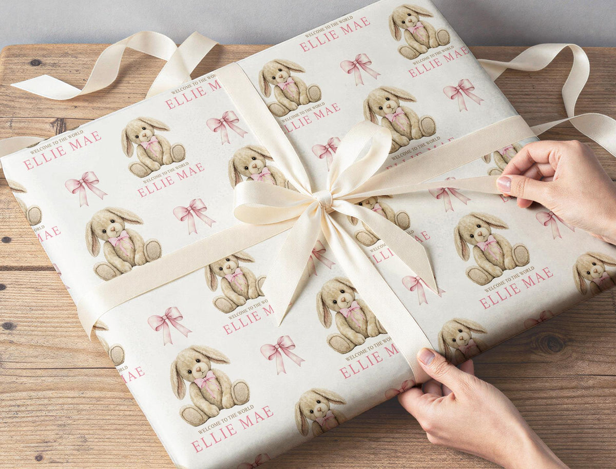 Detail shot of the personalised name printed within the pink bunny and teddy wrapping paper design
