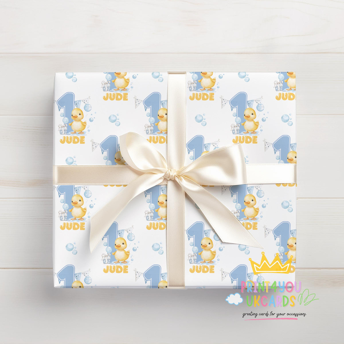 Personalised blue duck wrapping paper sheet laid flat showing the full pattern