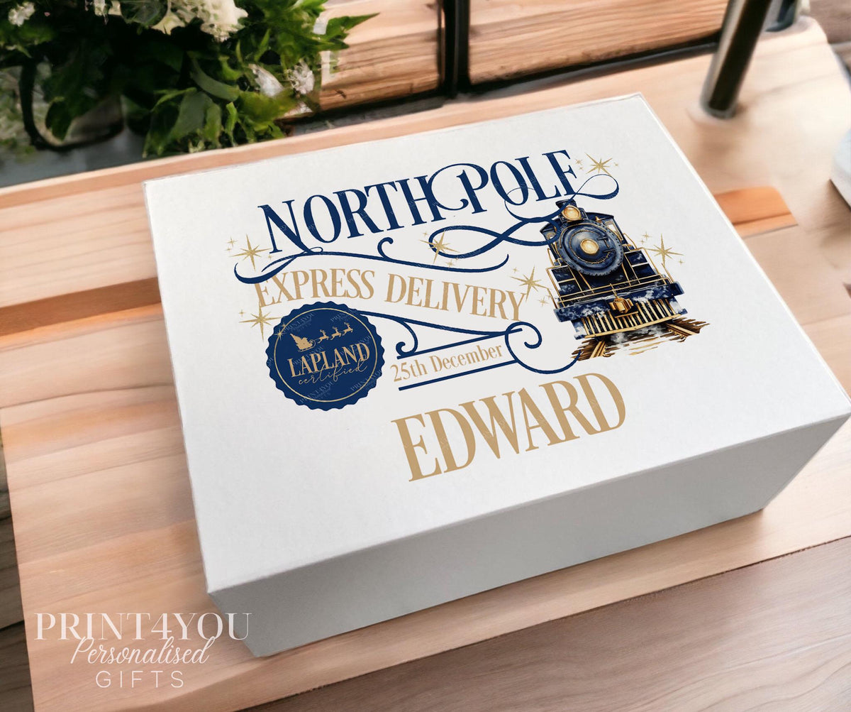 White Christmas keepsake box in the medium 16x20x8cm size, printed with a navy blue and gold North Pole Express train design, Lapland stamp and the name Edward