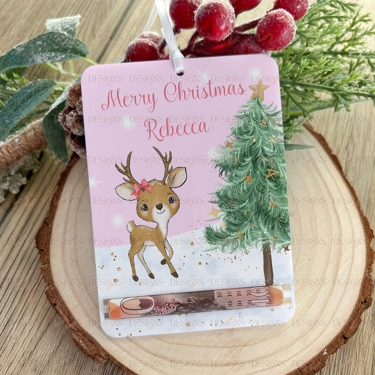Personalised tree-shaped acrylic money pouch with a reindeer design, printed with a name and hung with a ribbon