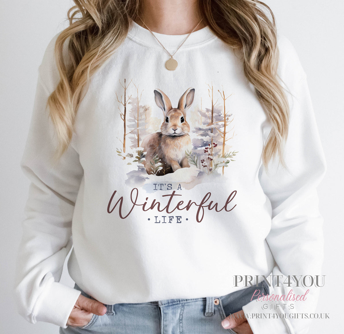 Ladies white sweatshirt with a woodland bunny rabbit design and It's a Winterful Life slogan