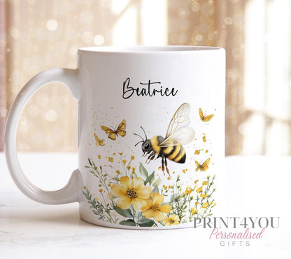 Bumble bee personalised mug shown with a yellow handle, printed with a name.