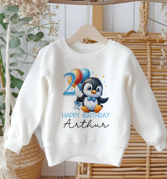 Personalised penguin birthday age sweatshirt with custom name and number, front view