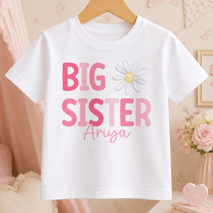 Personalised Big Sister t-shirt – white tee with pink BIG SISTER lettering, a daisy and the name Ariya in script