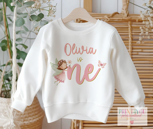 Baby girl 1st birthday sweatshirt with personalised fairy design and name, size 6-12 months, laid flat