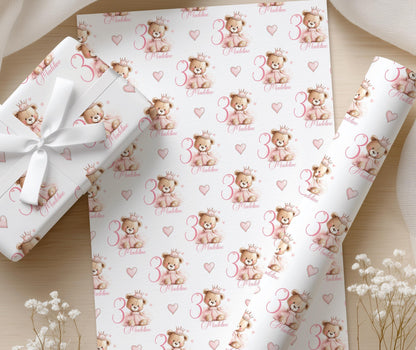 Close-up of the pink princess teddy bear wrapping paper pattern showing the personalised name and age.