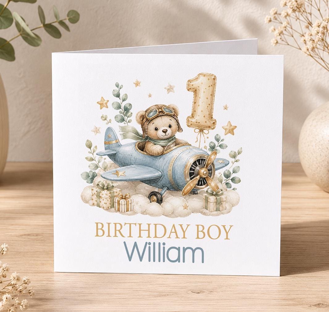 Personalised teddy aeroplane 1st birthday card – teddy flying a blue plane with a gold number 1 balloon, Birthday Boy William