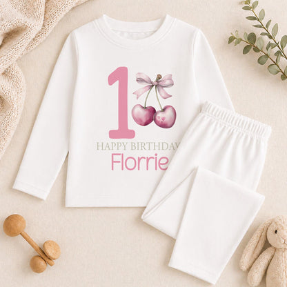 Personalised pink cherry print 1st birthday pyjamas with custom name printed on soft cotton