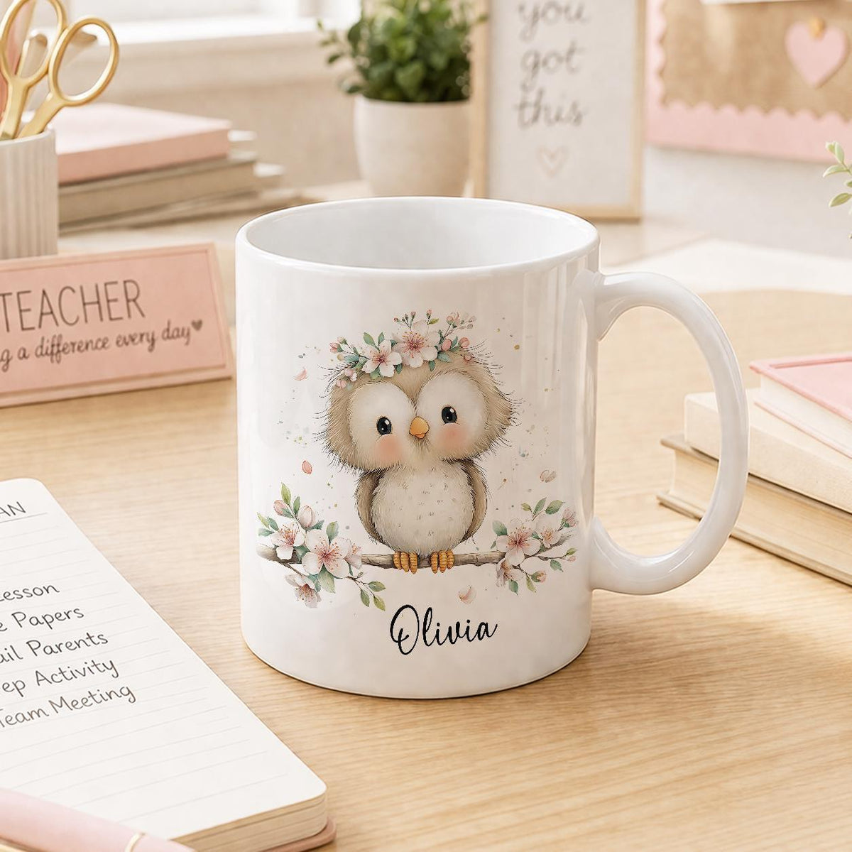 White ceramic mug printed with an owl and floral design, personalised with a name