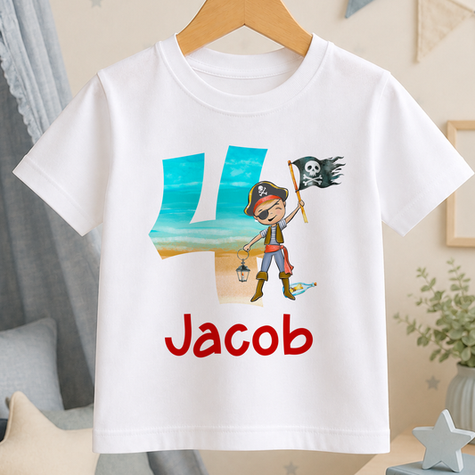 A white t-shirt with a pirate-themed design, including a character holding a pirate flag and the number "4" in the center. The text "Jacob" is printed below the design.