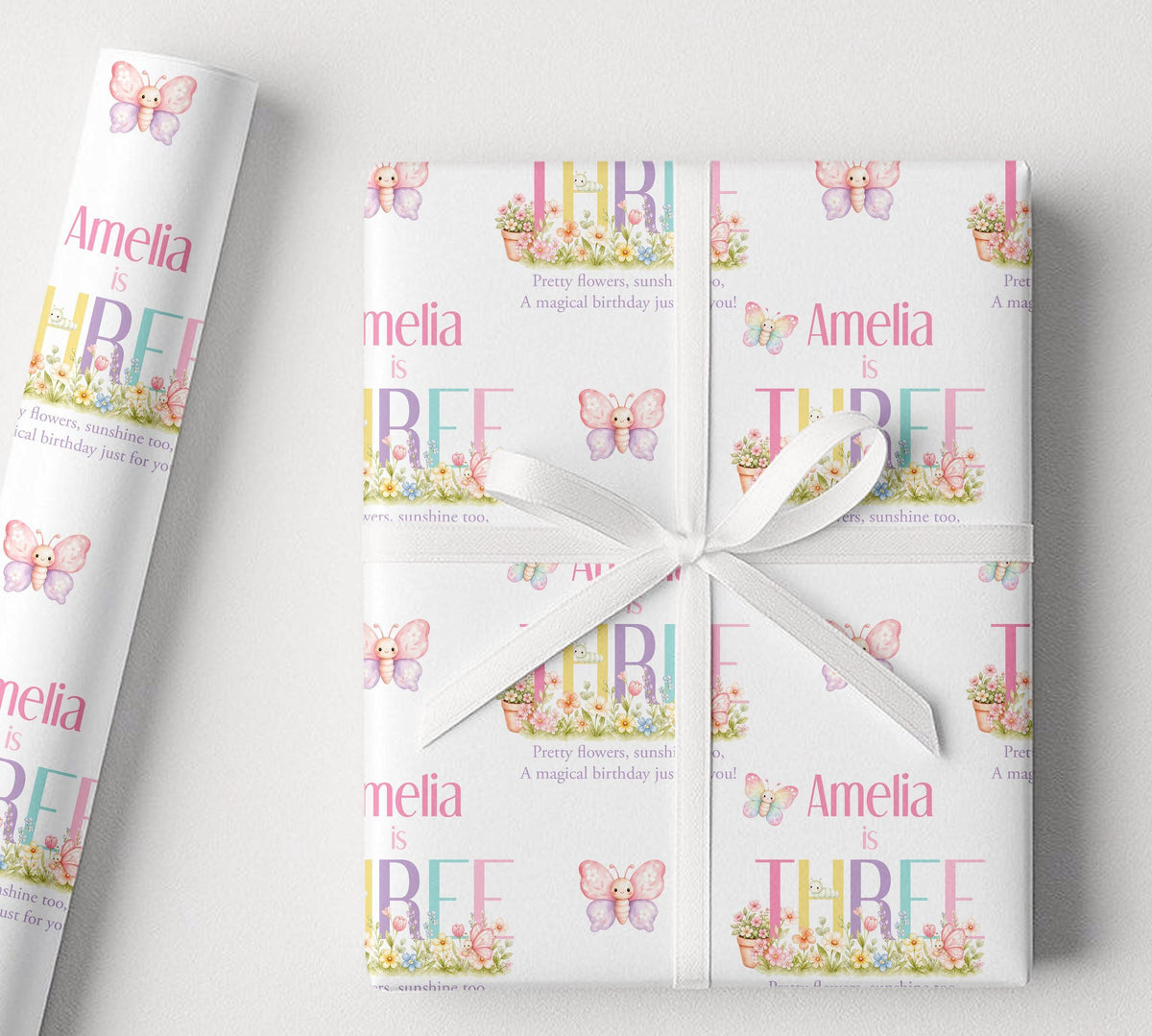 Sheet of personalised butterfly garden birthday wrapping paper laid flat