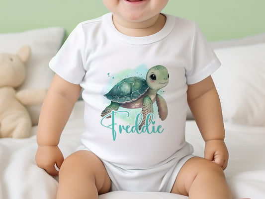 Personalised Sea Turtle design baby bib, printed with the baby's name on soft cotton.