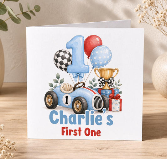 Personalised racing car 1st birthday card – blue race car, number 1 balloon, trophy and Charlie’s First One