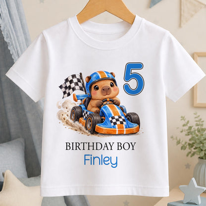 Personalised race car birthday t-shirt – white tee with a capybara in an orange go-kart, chequered flag, blue number 5, Birthday Boy and the name Finley