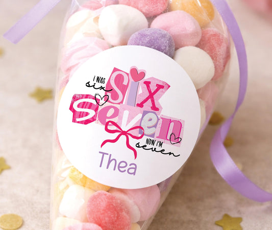 Round glossy stickers featuring a colourful balloon and confetti birthday design, personalised with a name