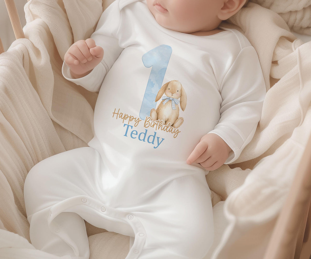 Personalised blue bunny first birthday sleepsuit with custom name print