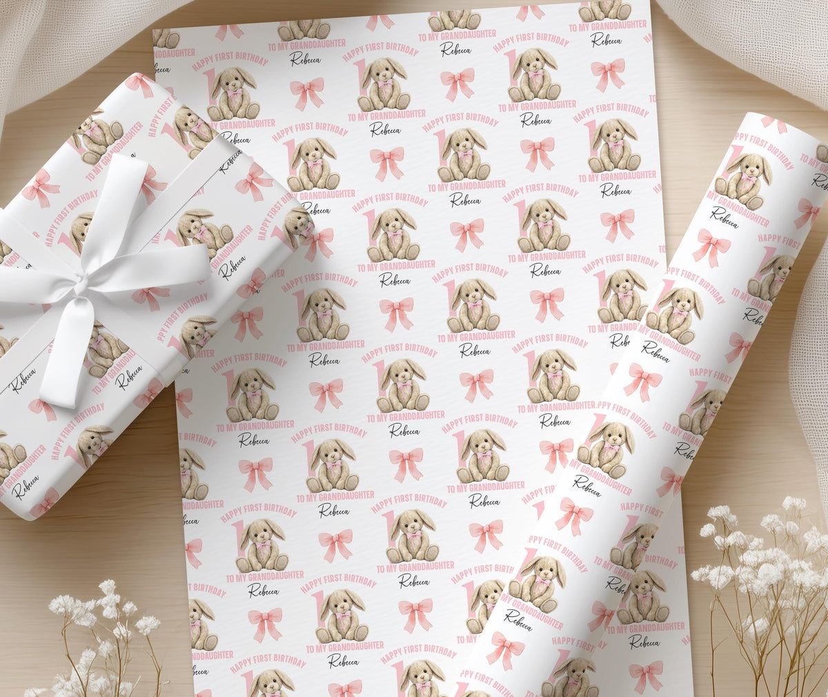 Close-up of the pink rabbit and bow pattern on the personalised wrapping paper