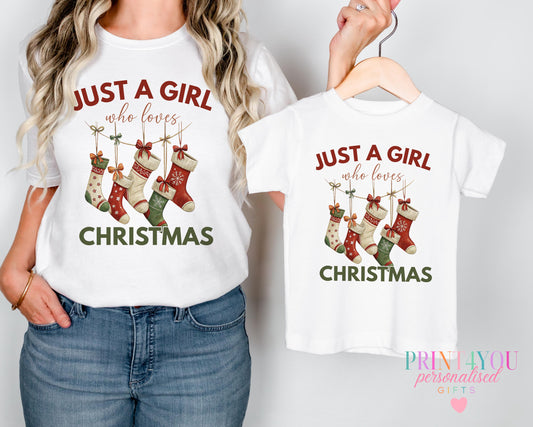 Mum and daughter wearing matching Christmas stocking design t-shirts with, adult and child sizes