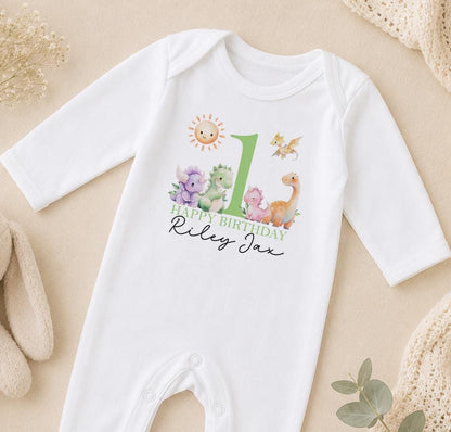 Personalised dinosaur first birthday sleepsuit with Happy Birthday Riley Jax