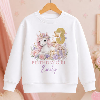 Personalised white Birthday Girl sweatshirt with a watercolour unicorn, pastel flowers, gold number 3 and a name