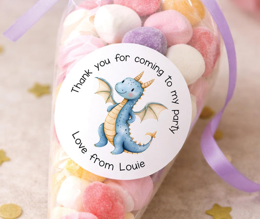 Sheet of glossy round dragon birthday stickers in bright party colours, ready to be personalised with a child's name.