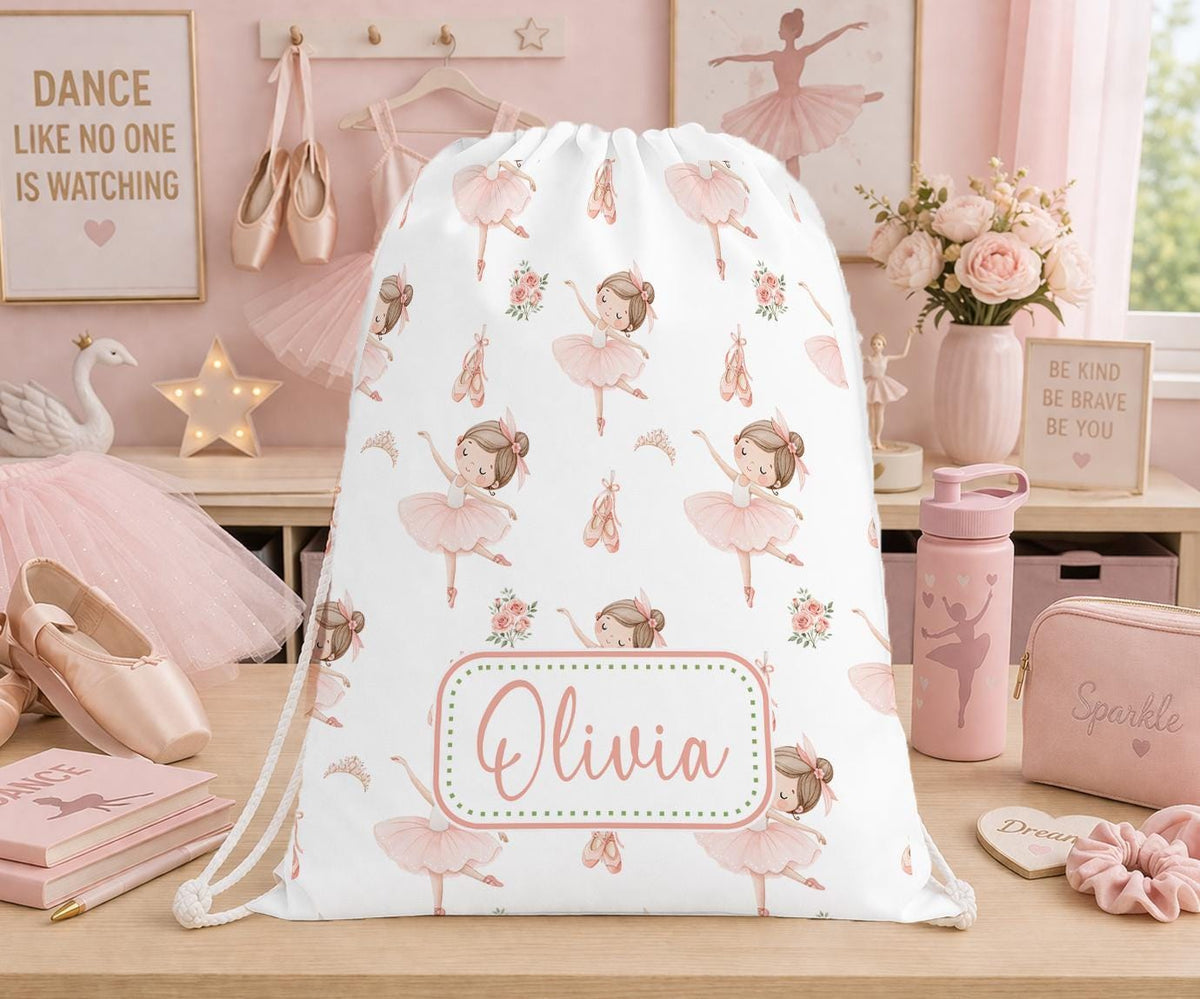 White drawstring PE bag printed with pink ballerinas, ballet shoes and flowers, personalised with the name Olivia.