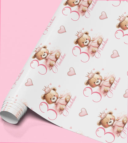 Roll of pink wrapping paper with crowned teddy bears personalised with the name Madeline.