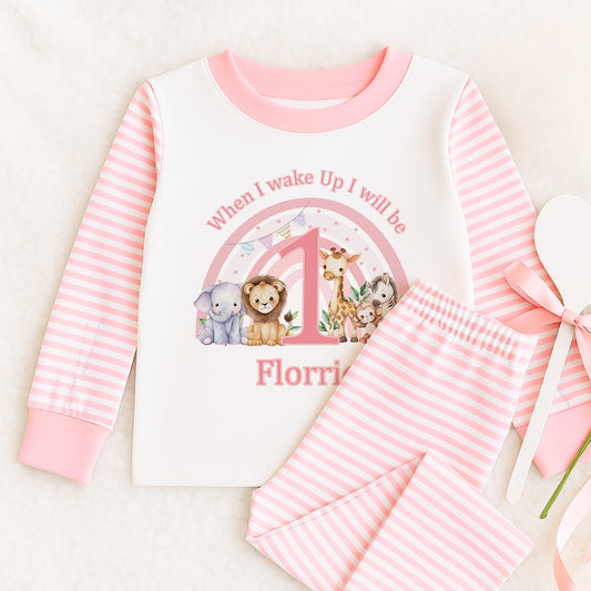 Pink and white striped children's pyjamas with a safari and rainbow print and personalised 'When I wake up I will be...' wording, size 6-12 months