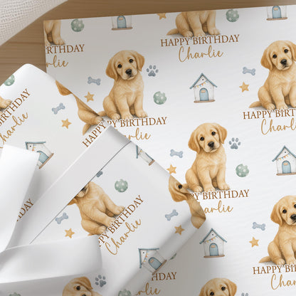 Roll of personalised Golden Retriever wrapping paper shown rolled and ready, with the repeating puppy and birthday pattern visible.