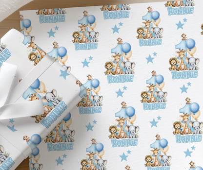 Roll of personalised blue safari animal wrapping paper with an example name printed on the design