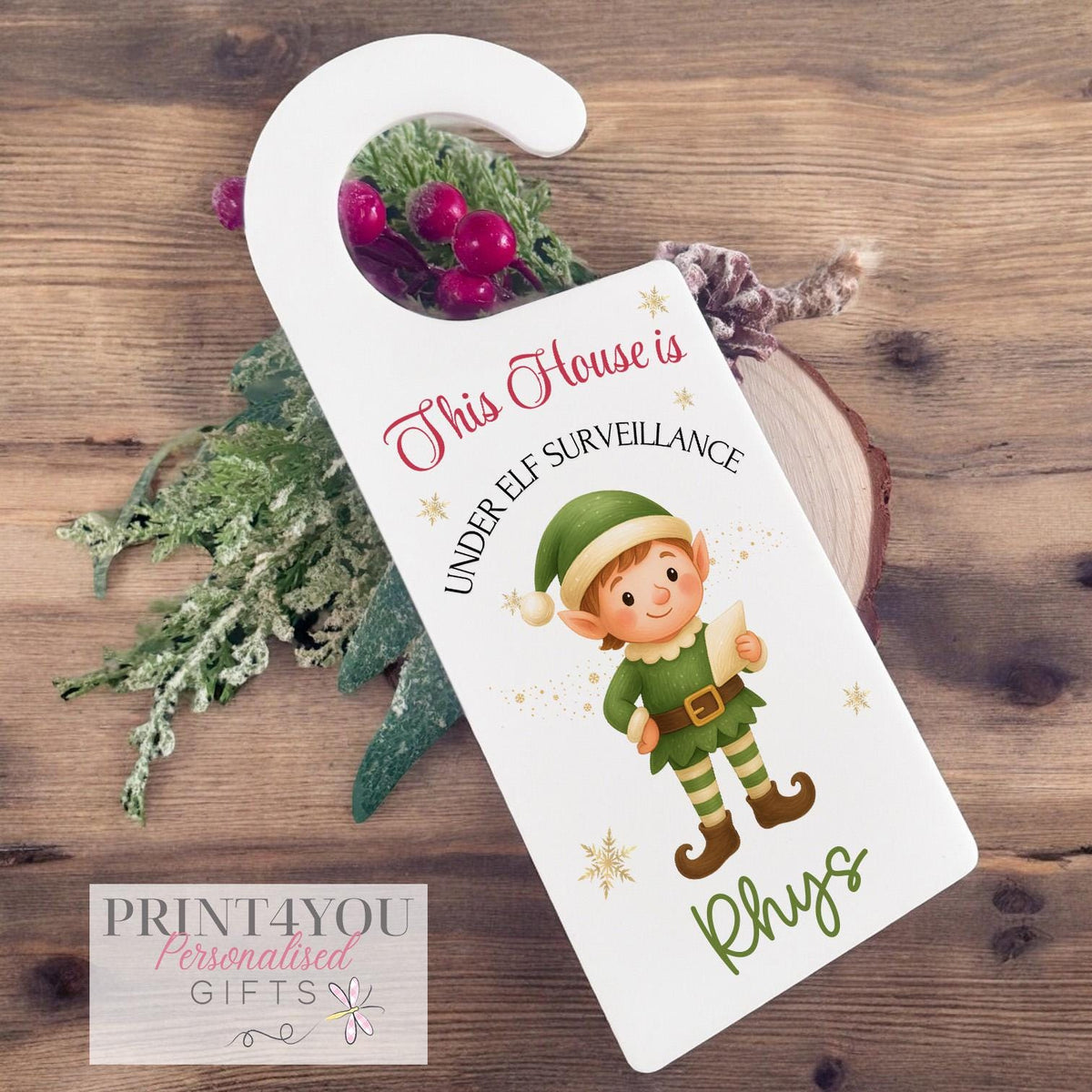 Personalised white acrylic elf door hanger with 'elf is watching' design and custom name