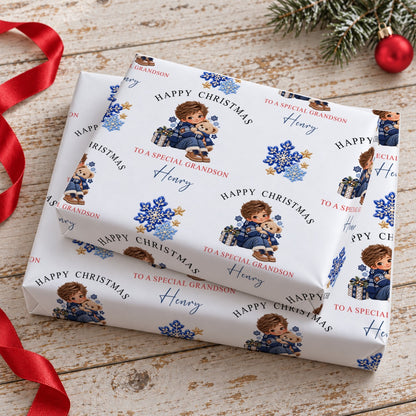 Stacked gifts wrapped in personalised boy and teddy Christmas wrapping paper printed with the name Henry