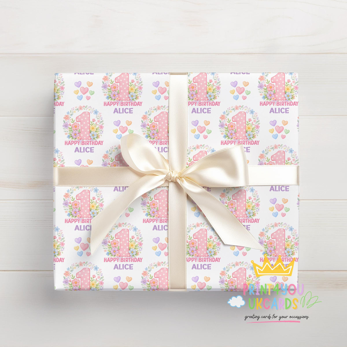 Personalised blossom number wrapping paper shown wrapped around a gift box to demonstrate the finished look.