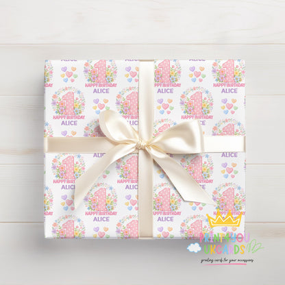 Personalised blossom number wrapping paper shown wrapped around a gift box to demonstrate the finished look.
