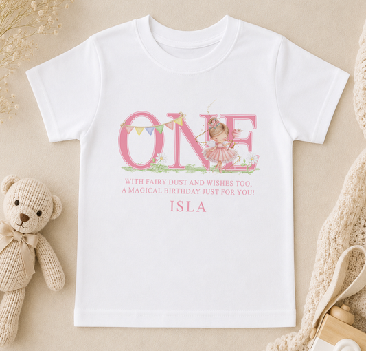 Personalised fairy design first birthday t-shirt printed with a pink 'ONE' and a custom name, styled with a teddy bear.