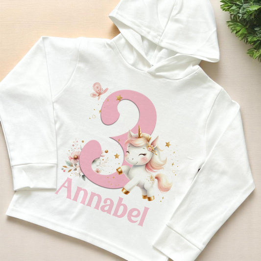 White personalised unicorn birthday hooded long-sleeve top, lightweight cotton jersey, size 6-12 months
