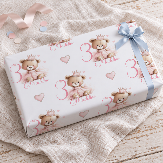a gift box with a teddy bear design and the number 3 printed on it.