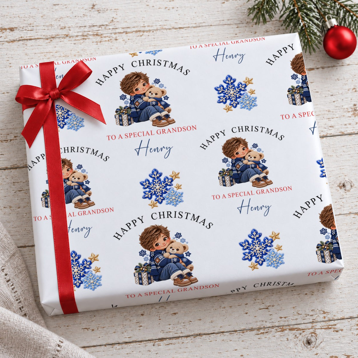 Present wrapped in personalised Happy Christmas To A Special Grandson wrapping paper with a red bow