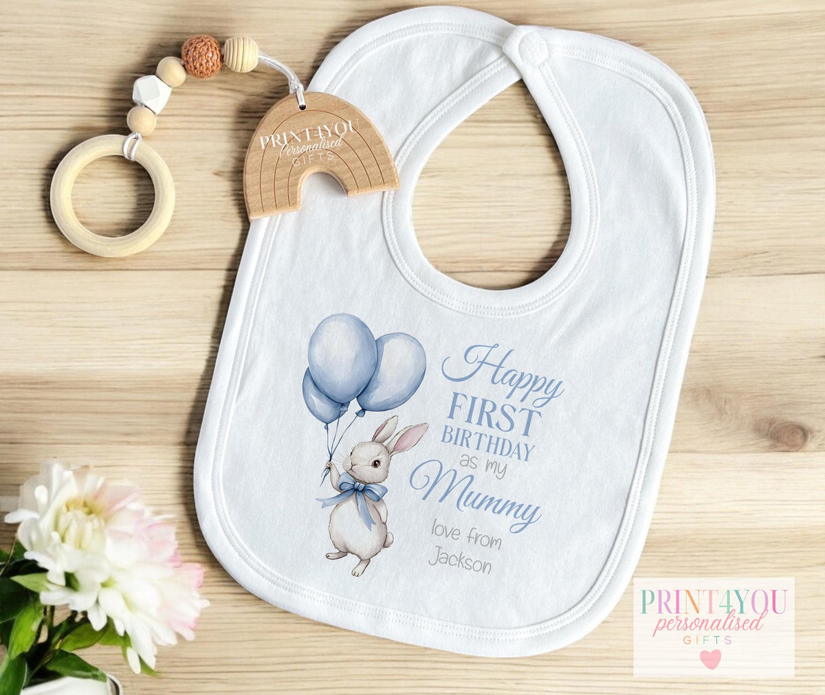 Personalised blue bunny first birthday t-shirt, printed with the baby's name and chosen family title.