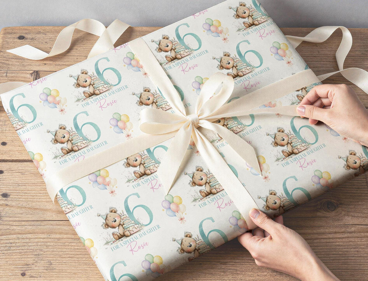 Teddy bear and balloon birthday wrapping paper pattern shown across a full sheet