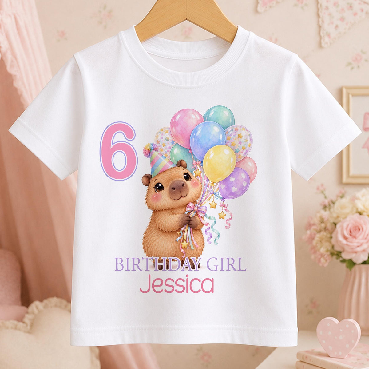 Personalised capybara birthday t-shirt – white tee with a capybara holding pastel balloons, pink number 6, Birthday Girl and the name Jessica
