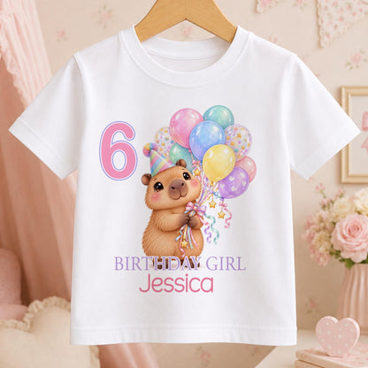 Personalised capybara birthday t-shirt – white tee with a capybara holding pastel balloons, pink number 6, Birthday Girl and the name Jessica