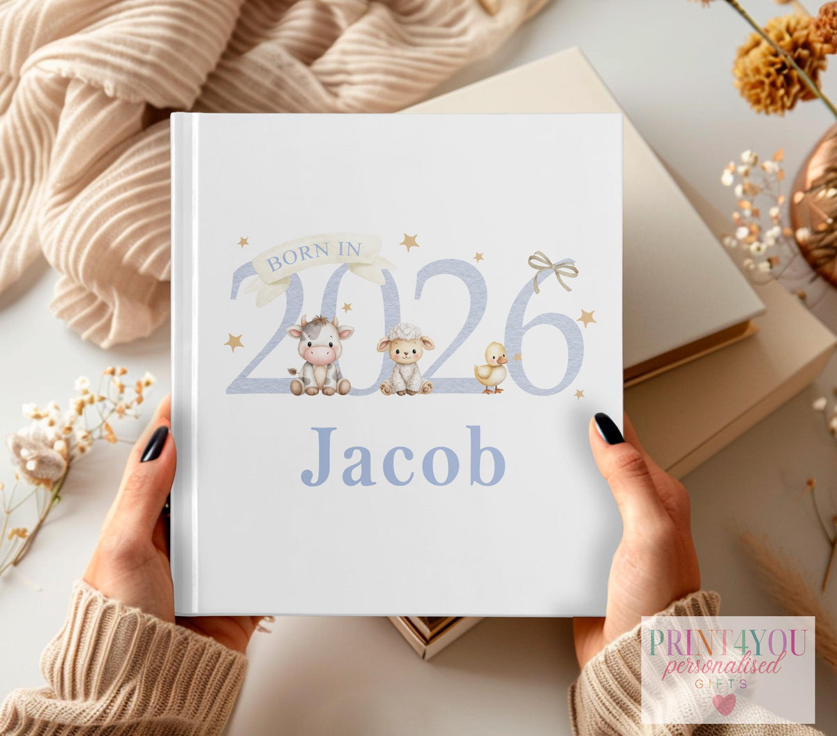 Personalised farm animal baby photo album in neutral blue with cow, lamb and chick design and custom name on the cover