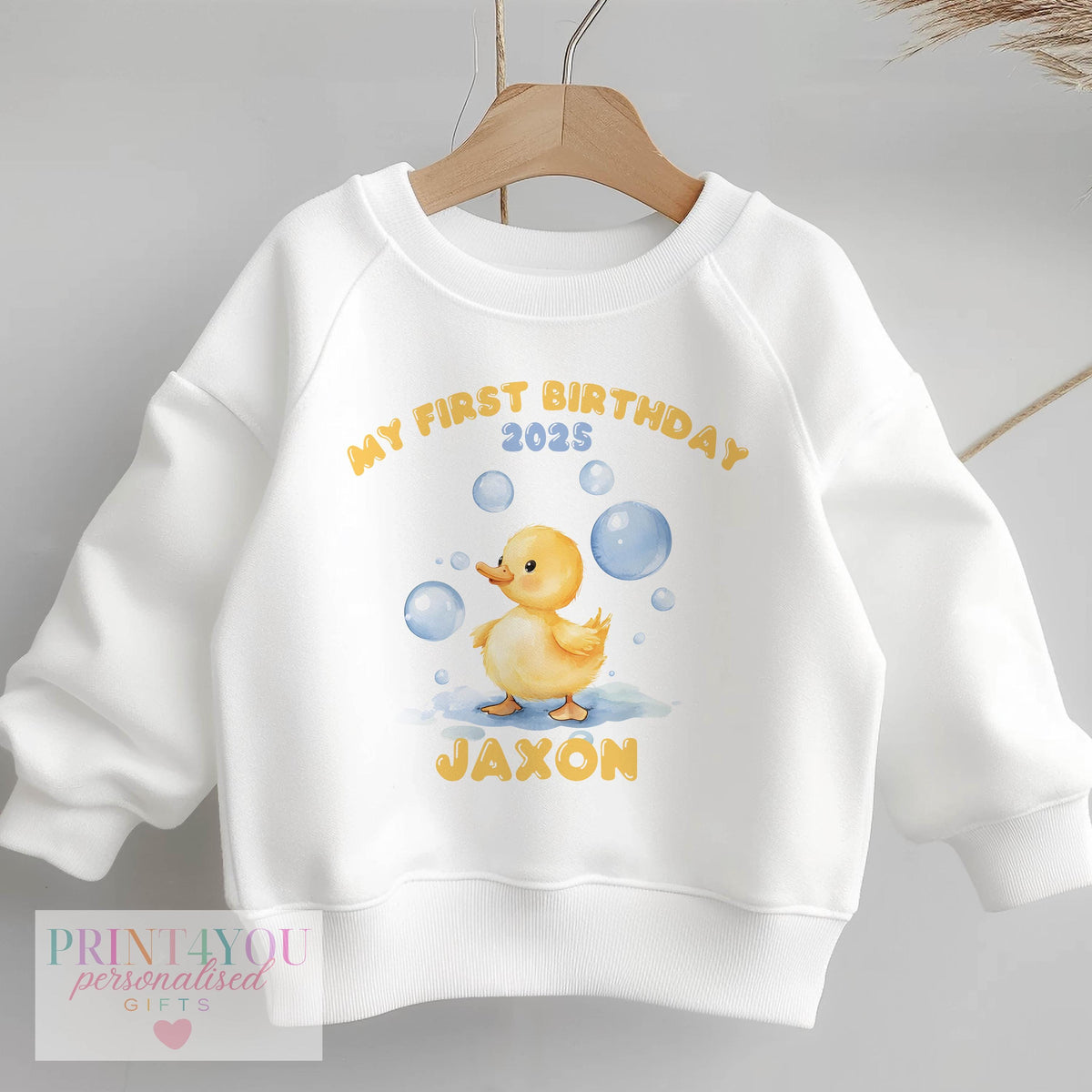 Personalised yellow duck and bubbles birthday sweatshirt in size 6-12 months