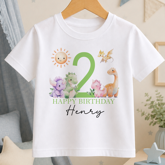 White kids t-shirt with a green cartoon dinosaur design, a large printed age number and personalised birthday message