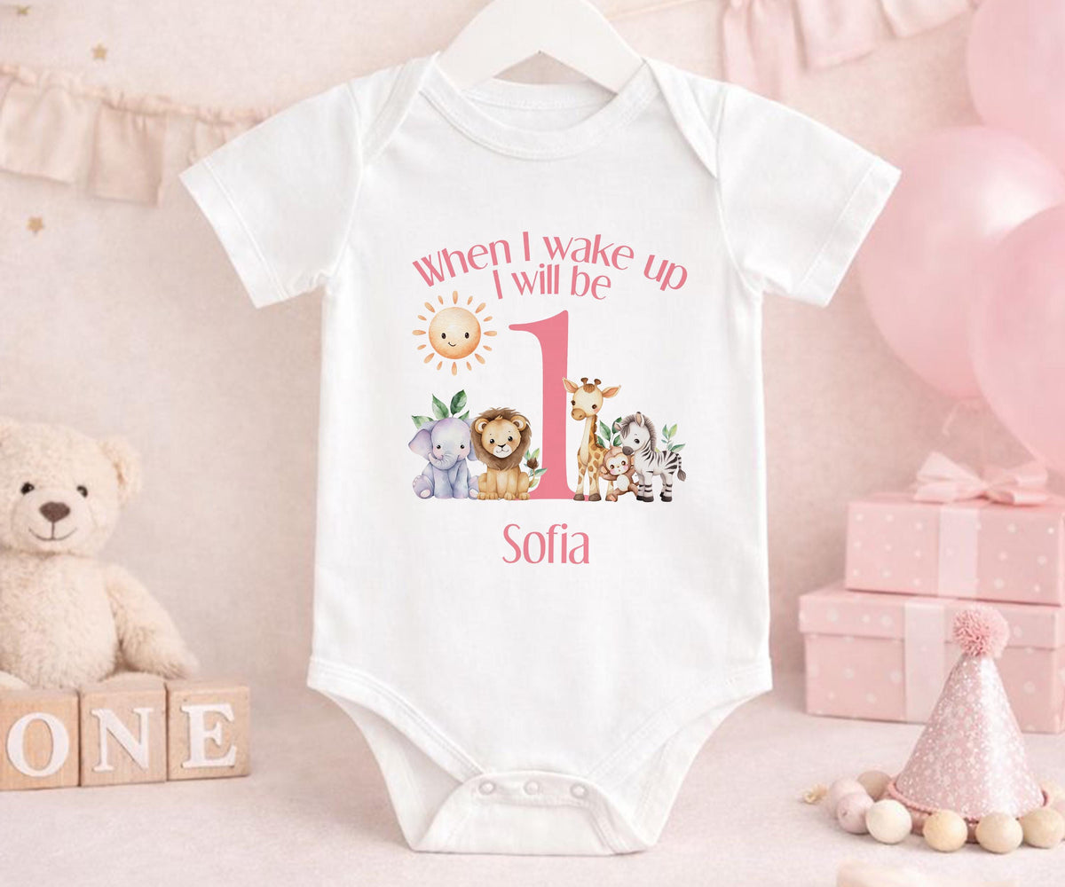 Pink safari first birthday outfit with number one and custom name printed on soft cotton