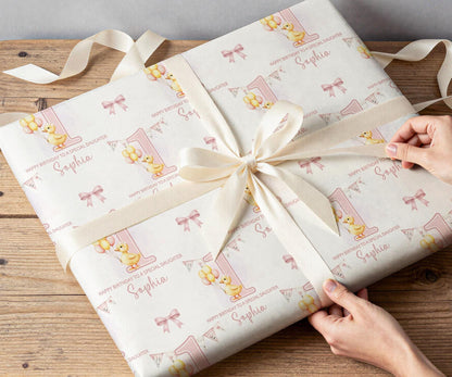 Personalised pink duck wrapping paper rolled and shown against a plain background