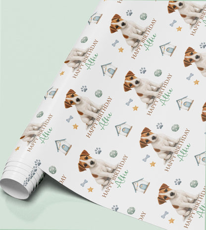 Personalised Jack Russell Terrier birthday wrapping paper featuring a cheeky dog, custom name, paw prints and dog toys.