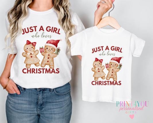 Mother and daughter wearing matching "Just a Girl Who Loves Christmas" t-shirts with a gingerbread couple design