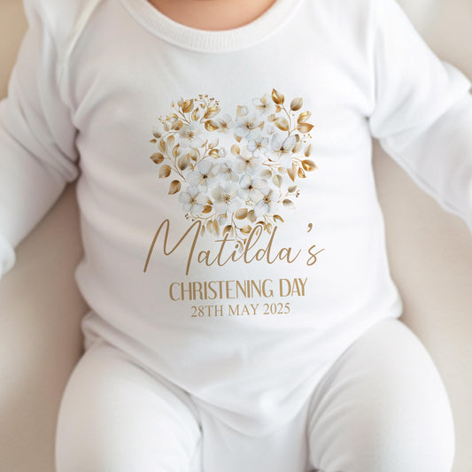 Personalised gold floral cross christening vest, printed with baby's name.